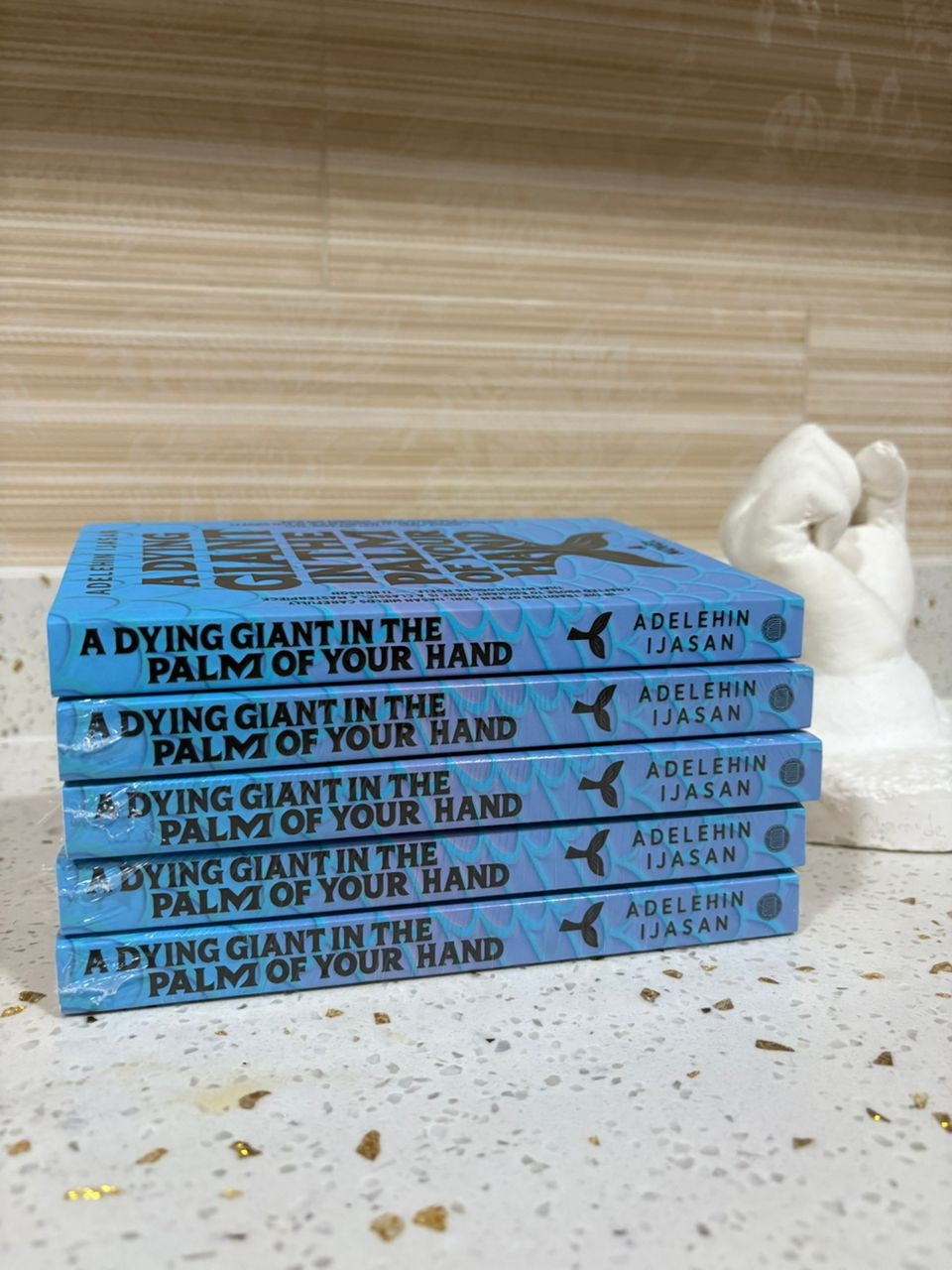Introducing A Dying Giant in the Palm of Your Hand: A Novel (Masobe Books 2026).